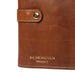Knitting bag in walnut/gold leather with snap closure.