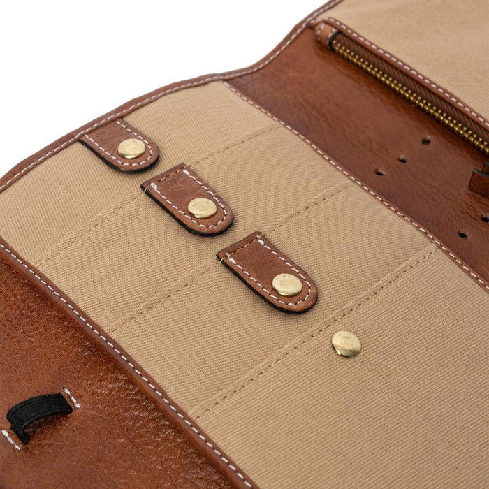 Knitting bag with pockets and snap closures in walnut and gold.