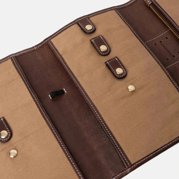 Knitting needle case in woodsmoke leather with pockets and elastic band.