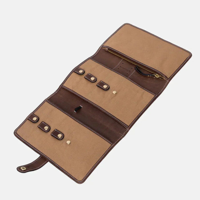 Handcrafted leather knitting needle case with multiple pockets, snap closures, zippered compartment, and elastic band, in Woodsmoke color.