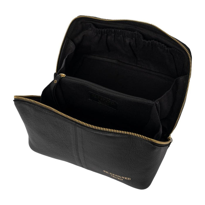 Knitting project bag in black and gold leather with organized compartments for tools.
