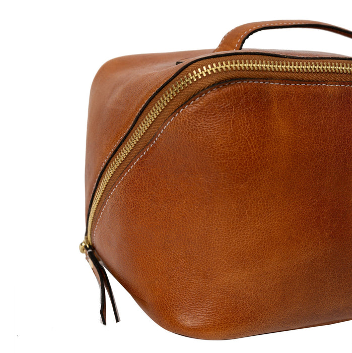 Knitting bag in burned tan and gold leather with zipper closure.