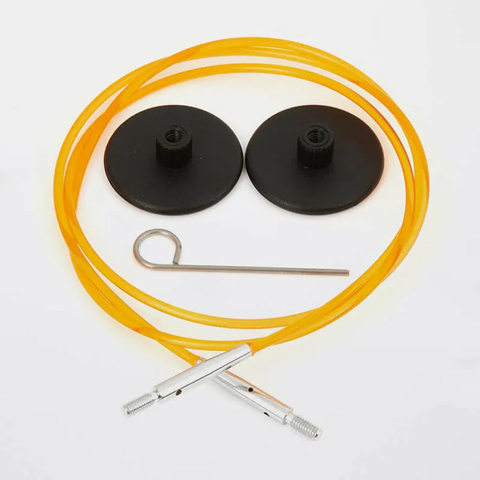 Set of orange cables with black connectors and a metal hook on a white background