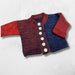 Cardigan and vest knit kit for babies, featuring a colorful variegated yarn.