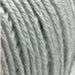 Close-up view of Sesia Bio Bimbo Organic Cotton yarn in light sage green, ideal for the Crossover Jacket & Hat knit kit.