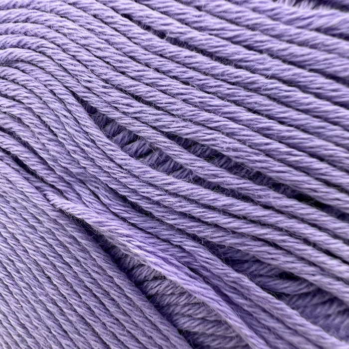 Organic purple cotton yarn skein for Crossover Jacket & Hat Knit Kit.