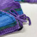 Knit crossover jacket and hat set in variegated organic cotton for babies, featuring ribbed edging and ties.