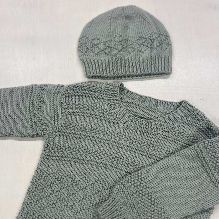 Knit textured sweater and hat set in gray, showcasing stripes and diamond patterns.