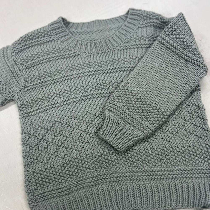 Knitted Goldie sweater with textured patterns made from 8ply merino wool for kids aged 1-10 years.