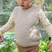 Beige Sille Slipover Mini knitted vest for children from PetiteKnit x Sandnes Garn Double Sunday knitting kit