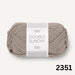 Beige knitted children’s vest from Sille Slipover Mini Knitting Kit by PetiteKnit and Sandnes Garn Double Sunday