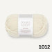 Child wearing beige Sille Slipover Mini knitted vest from the Sille Slipover Mini Knitting Kit by PetiteKnit and Sandnes Garn Double Sunday