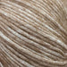 Luxurious Chaska Wara yarn close-up showing soft, fluffy fibers in a light brown shade for knitting projects.