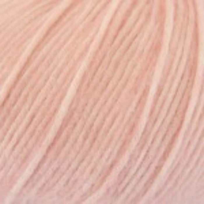 Soft blush pink yarn close-up from Simple Triangle Shawl Knit Kit.