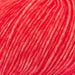Close-up view of Chaska Wara DK yarn in vibrant red for knitting projects.