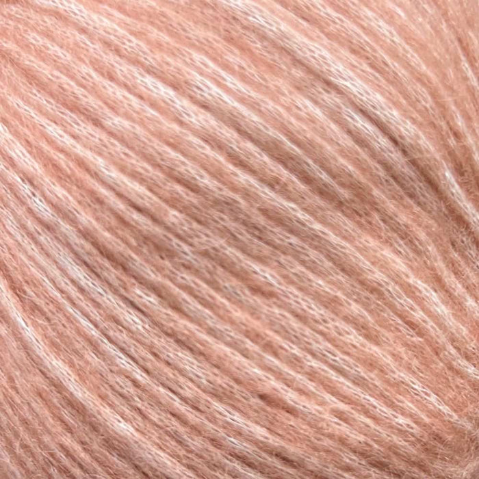 Luxuriously soft yarn for Simple Triangle Shawl Knit Kit, featuring Chaska Wara DK/8ply in a peach hue, ideal for cozy and stylish knit projects.