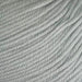12-ply New Zealand Merino wool yarn, light color, soft texture.