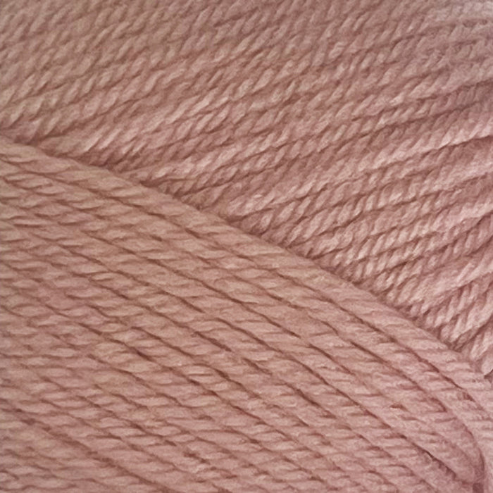 12-ply New Zealand Merino wool yarn in soft pink, showcasing its luxurious texture and premium quality.