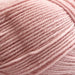 Soft pink 4ply New Zealand Merino wool yarn for textured baby jacket knitting kit.