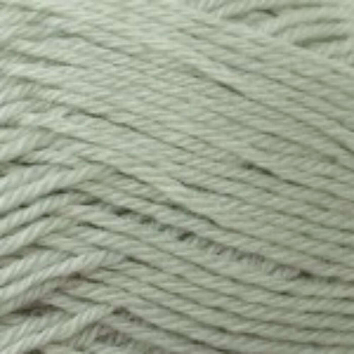 Close-up of soft green 4ply yarn used in the Textured Baby Jacket & Hat Knitting Kit.