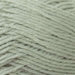 Close-up of soft green 4ply yarn used in the Textured Baby Jacket & Hat Knitting Kit.