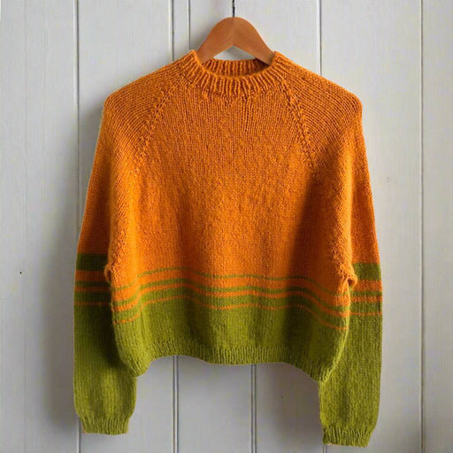 Striped jumper knit kit featuring cozy top-down style in vibrant orange and green hues.