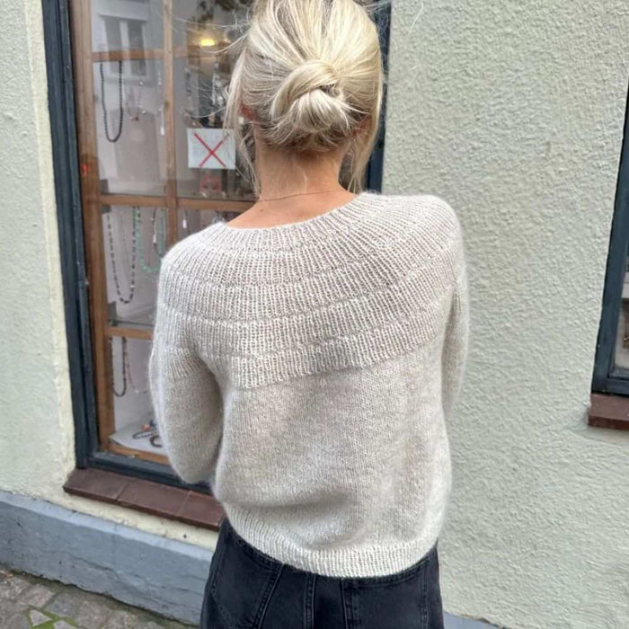 PetiteKnit Anker's Sweater adult knitting pattern, beige ribbed yoke design.