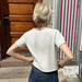 Cloud Tee Knitting Pattern by PetiteKnit, back view of white short-sleeve knit from top down.