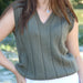 Olive green V-neck vest with vertical panel pattern, knitted using Touch Merino 8ply yarn.