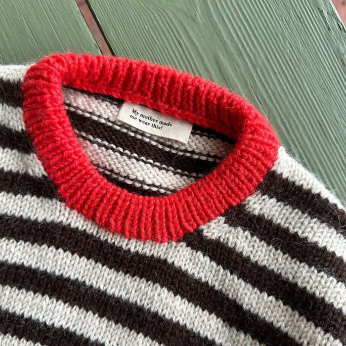 Striped Holger sweater with red ribbed neck from PetiteKnit knitting pattern.