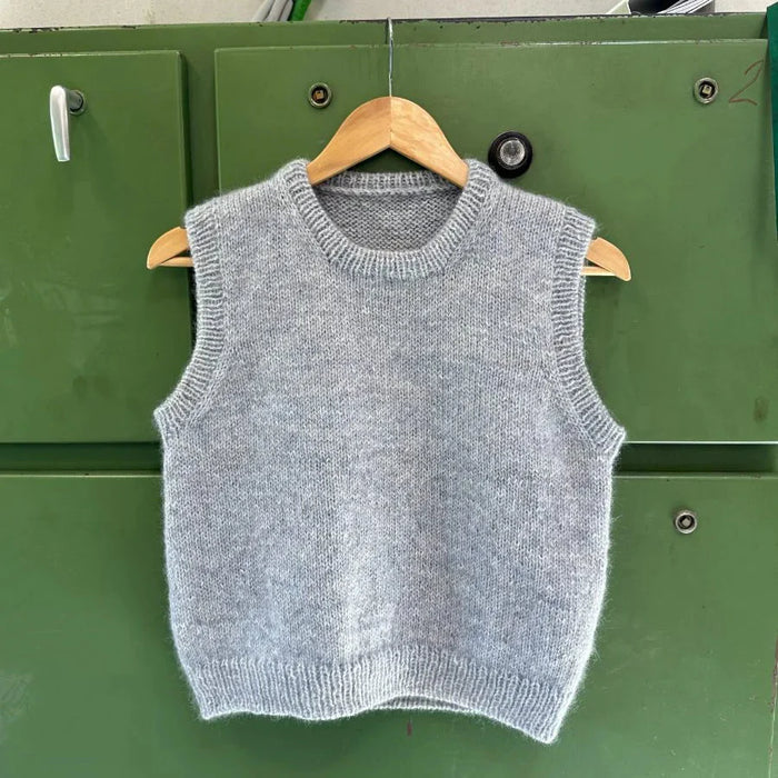 Woman wearing a hand-knitted Novice Slipover in stockinette stitch with ribbed edges, styled casually