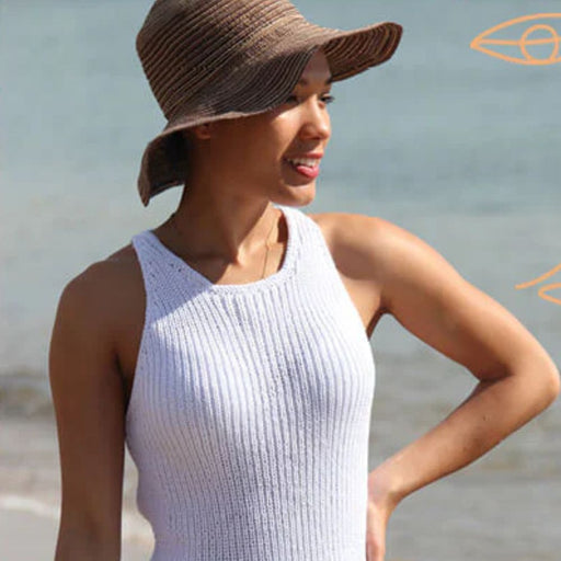 Women's sleeveless ribbed top in white, knitted using CRUCCI Pure Cotton 8ply, perfect for intermediate knitters.