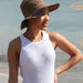 Women's sleeveless ribbed top in white, knitted using CRUCCI Pure Cotton 8ply, perfect for intermediate knitters.