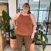Audrey Top Knitting Pattern by PetiteKnit, featuring a sleeveless stockinette stitch design with i-cord straps, modeled by a person indoors.