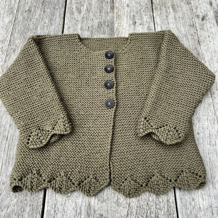 Bobbie Cardigan with lace edge and buttons, knitted in green yarn, ideal for 3 months to 6 years.