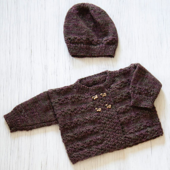 Baby cardigan and hat knitting pattern in Naturally Omana Print 4ply yarn, featuring textured stitch and button detail.