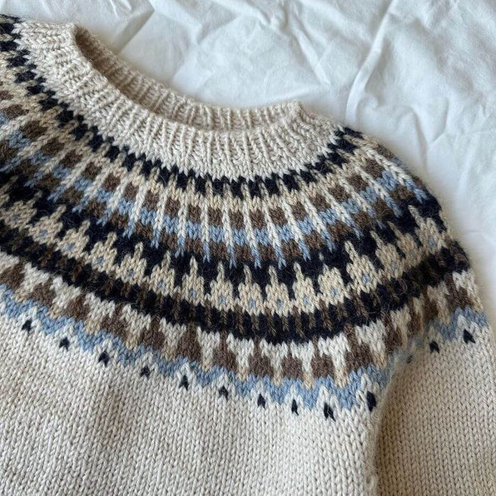 Junior knitting pattern for Celeste Sweater by PetiteKnit, featuring circular yoke and colorwork design.