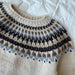Junior knitting pattern for Celeste Sweater by PetiteKnit, featuring circular yoke and colorwork design.