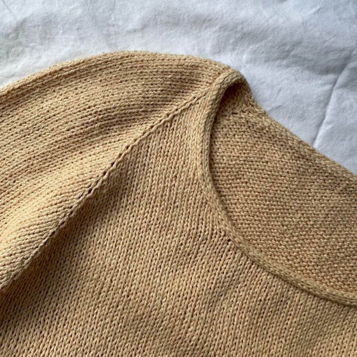 Cumulus Tee O Neck knitting pattern by PetiteKnit, showcasing detailed stockinette stitch and round neck finish.