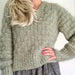 V-neck jumper featuring basket weave stitch in knitting pattern.