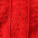 Texture pattern on red Esther Sweater Junior knitting pattern.