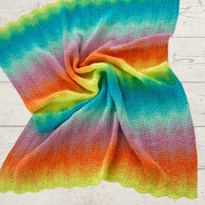 Garter ripple stitch pram blanket knitting pattern with vibrant colors.