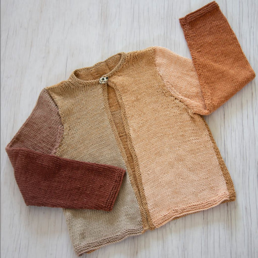 Girls' cardigan knitting pattern K3034 in multi-tone yarn with garter stitch borders and button closure.