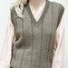 Unisex V-neck vest in olive yarn, showcasing a vertical panel pattern; part of the Harry Vest Knitting Pattern collection.