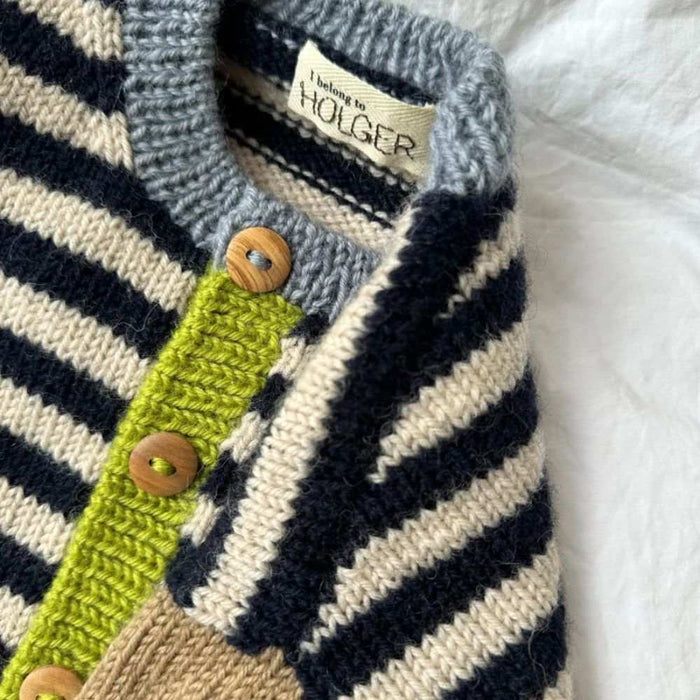 Holger Cardigan knitting pattern close-up, featuring striped stockinette stitch with contrasting solid colors for sleeves, plackets, and neck edge, by PetiteKnit.