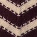 Close-up of two-colored striped knitting pattern from PetiteKnit cardigan.