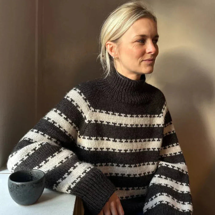 PetiteKnit Key Sweater with striped pattern, worn by model, showcasing ribbed neckline and cuffs.
