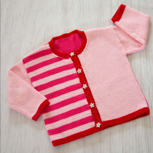 Kids cardigan in pink and red stripes with star buttons, knitted in Sesia Bio Sunny DK/8ply yarn.
