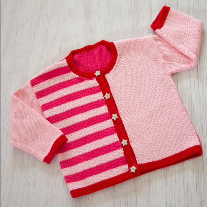 Kids cardigan in pink and red stripes with star buttons, knitted in Sesia Bio Sunny DK/8ply yarn.