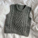 Moby Slipover Baby knitting pattern featuring textured cable design by PetiteKnit.